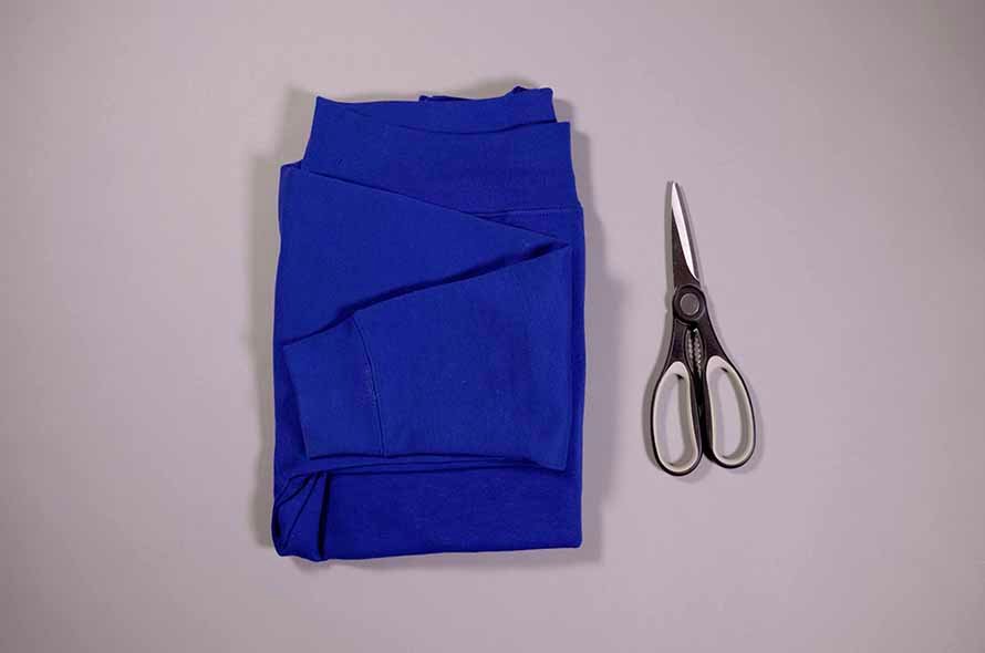 Jumper and a pair of scissors on the table