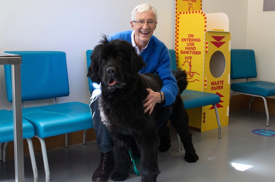 Paul O'Grady with a big black fluffy dog