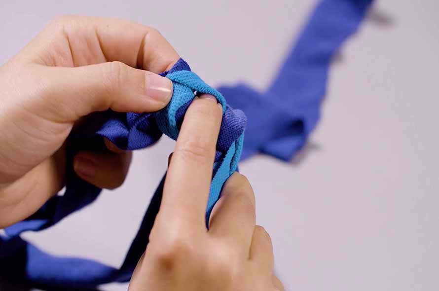 Pieces of fabric being tied together