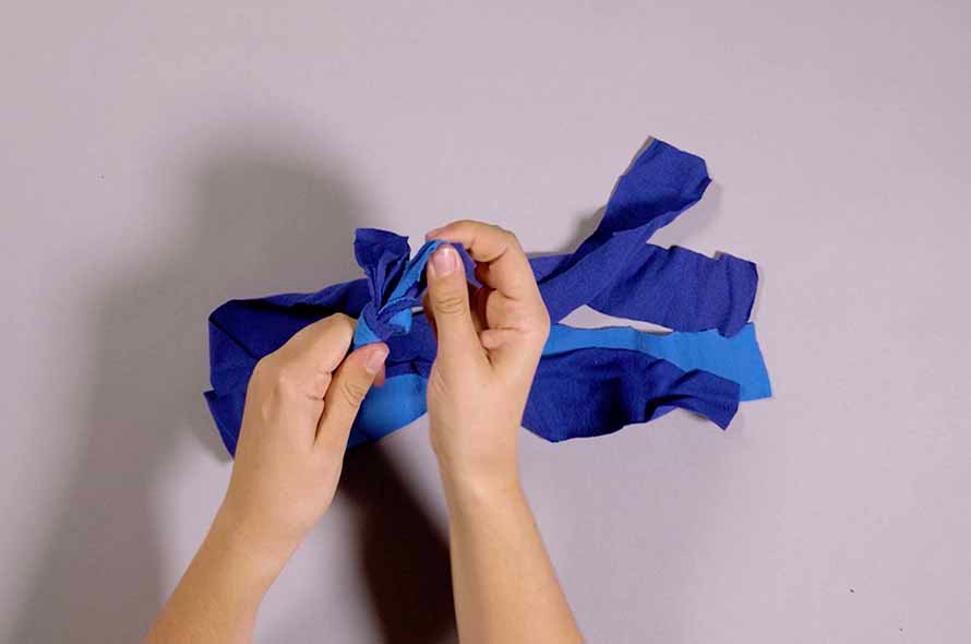 Pieces of fabric being tied together