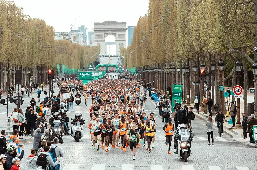 A group of people running from a start line