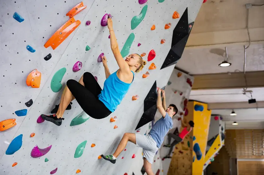 A couple rock climbing.